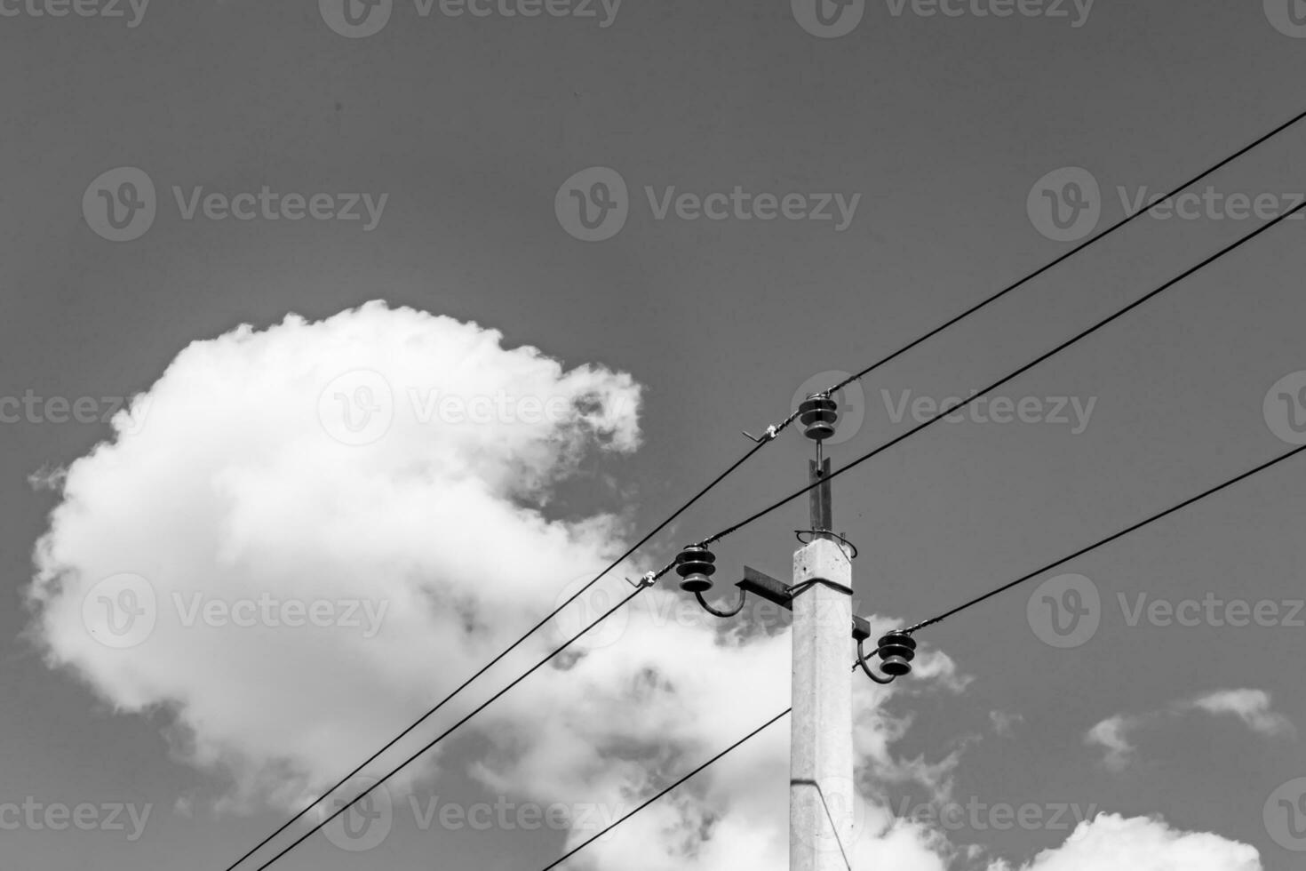 Power electric pole with line wire on light background close up photo