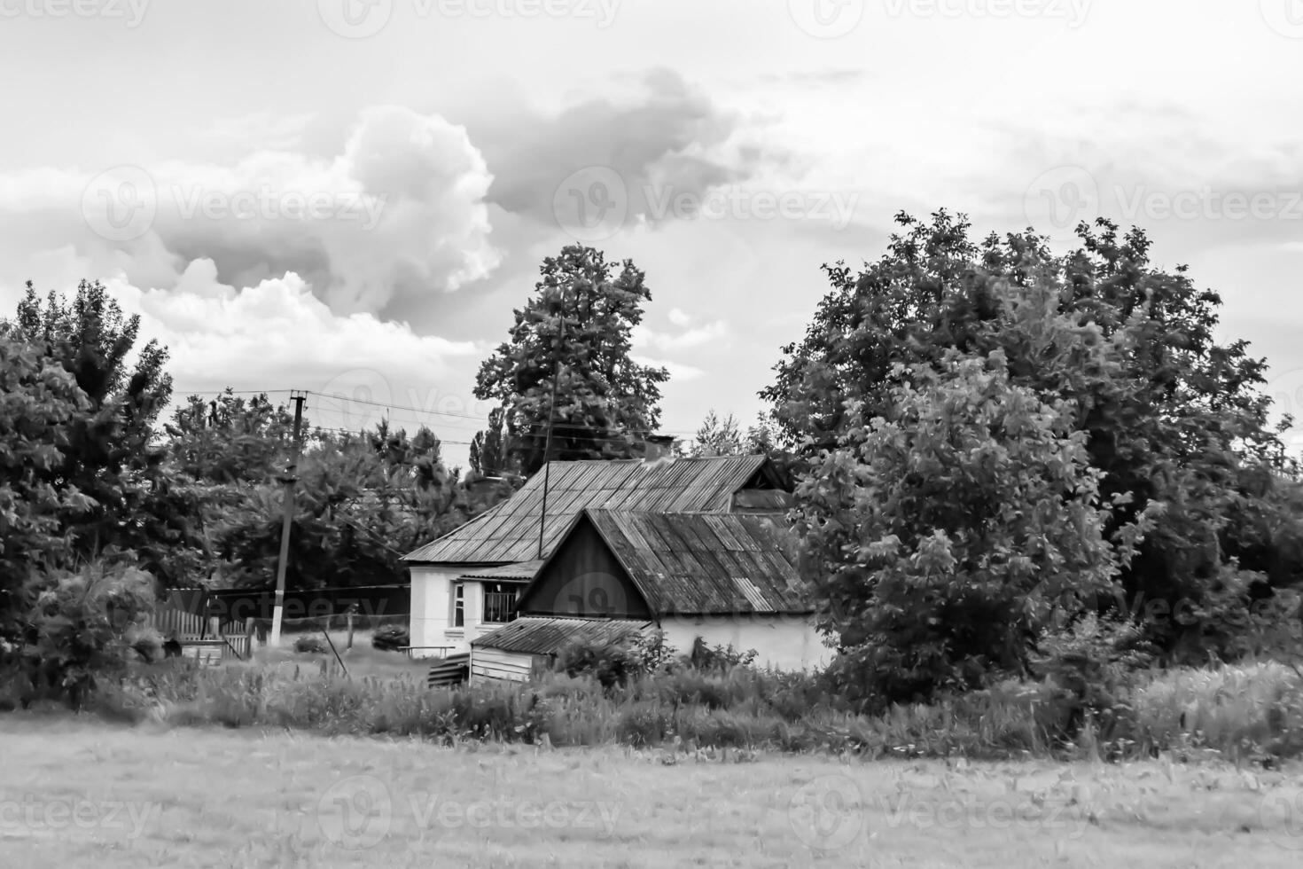 Beautiful old abandoned building farm house in countryside on natural background photo