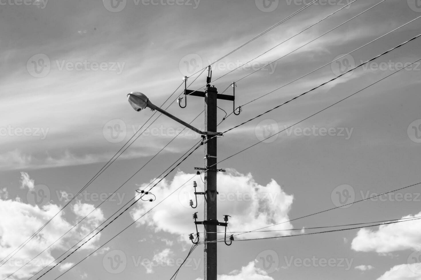 Power electric pole with line wire on light background close up photo