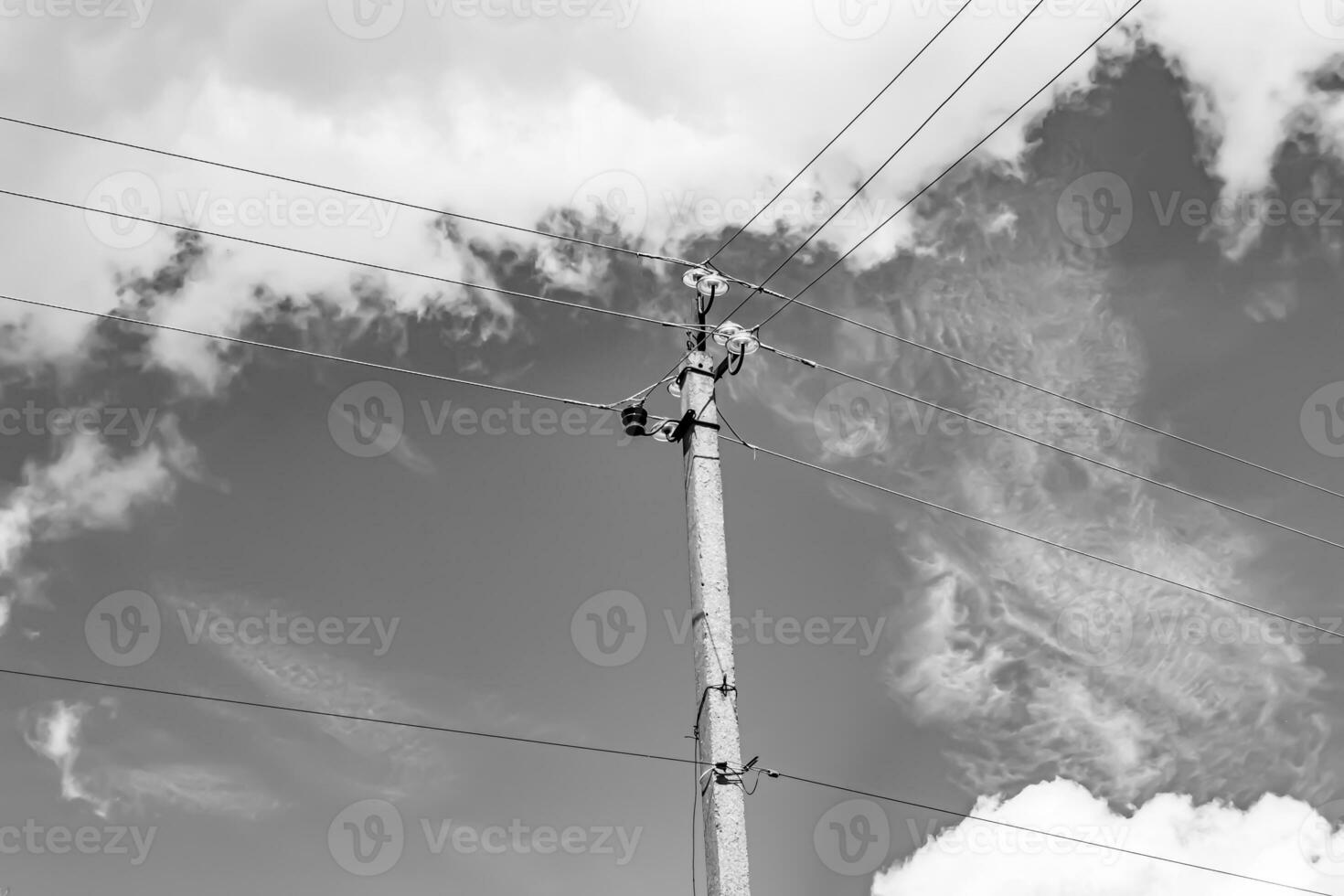 Power electric pole with line wire on light background close up photo