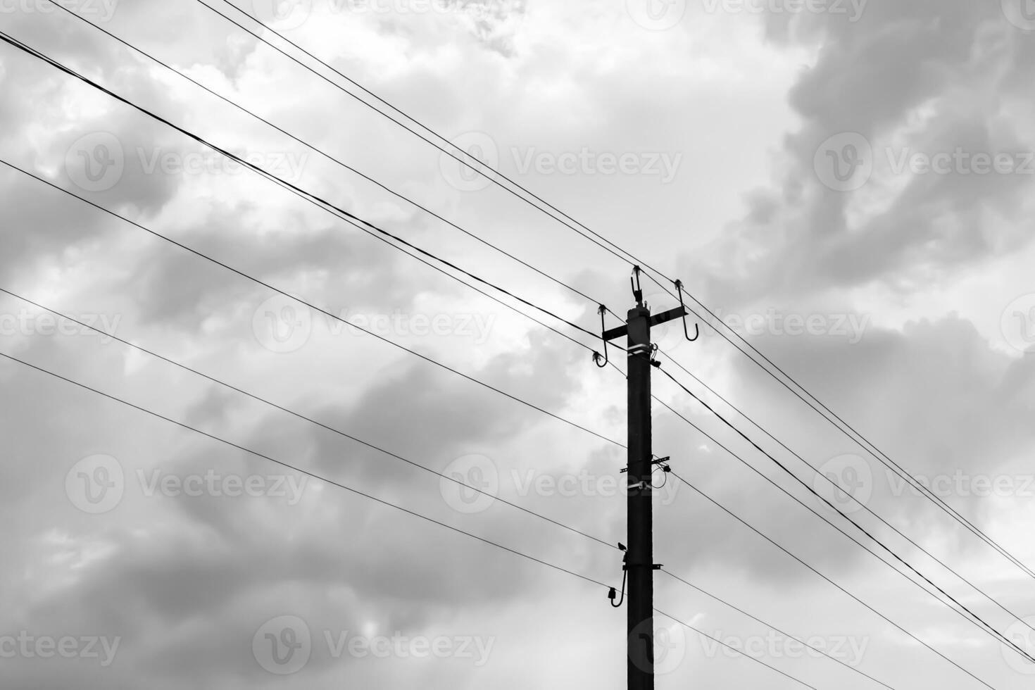 Power electric pole with line wire on light background close up photo