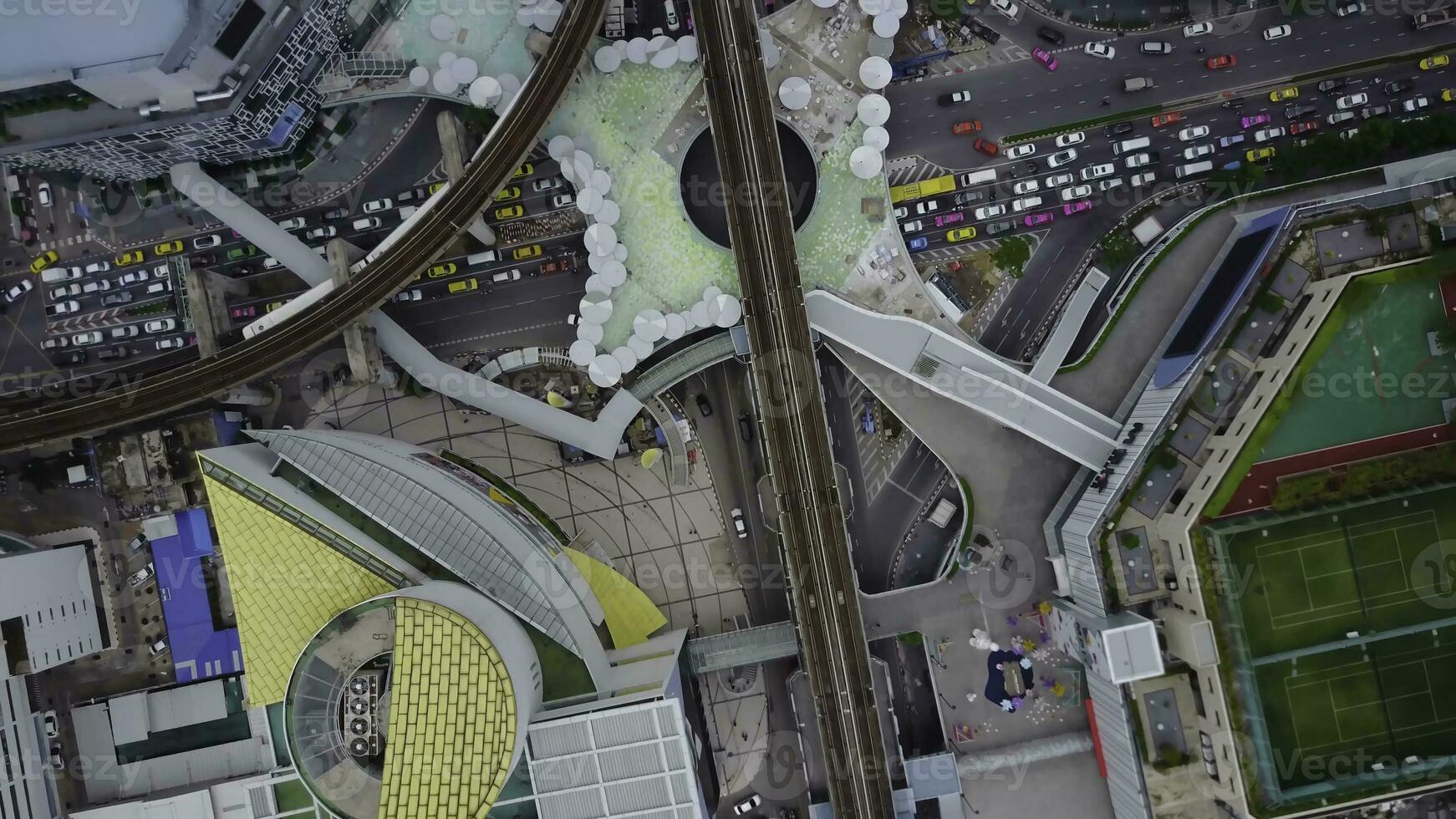 Top view city and Sky Train of Bangkok going out from station. Top view of modern city and traine going photo