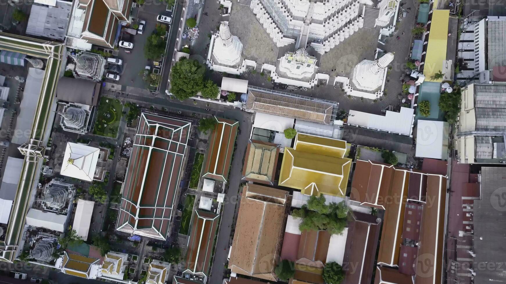 Nice view from the top of houses with tiled roofs. Top view of modern and old houses of the city. Cityscape of town and city from top view. Old and modern architecture of different styles. Authentic photo