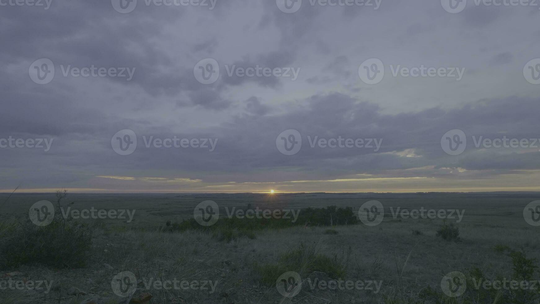 Natural Sunrise Over Field Or Meadow. Bright Dramatic Sky And Dark Ground. Countryside Landscape Under Scenic Colorful Sky At Sunset Dawn Sunrise. Sun Over Skyline, Horizon. Warm Colours photo