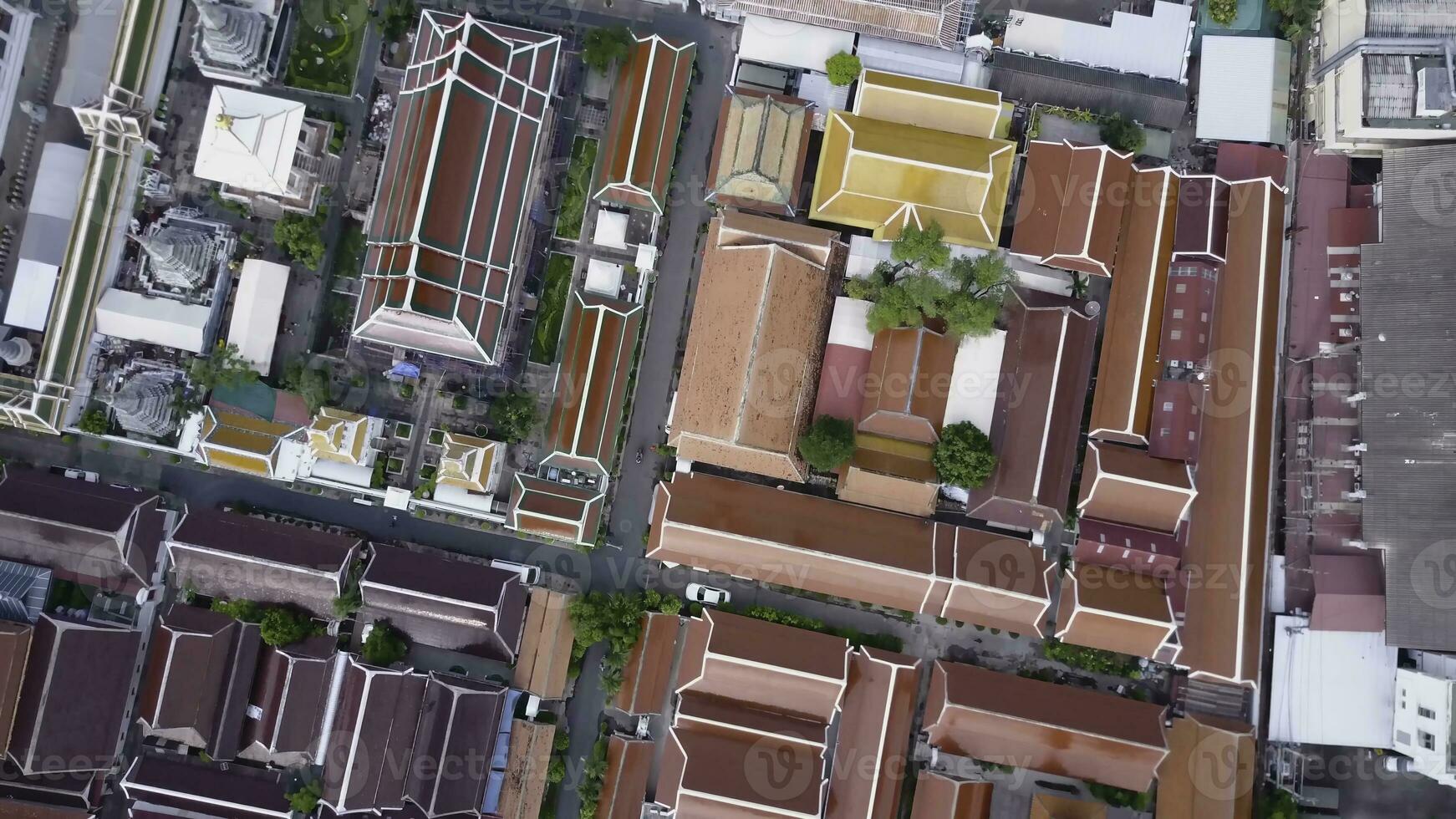 Nice view from the top of houses with tiled roofs. Top view of modern and old houses of the city. Cityscape of town and city from top view. Old and modern architecture of different styles. Authentic photo