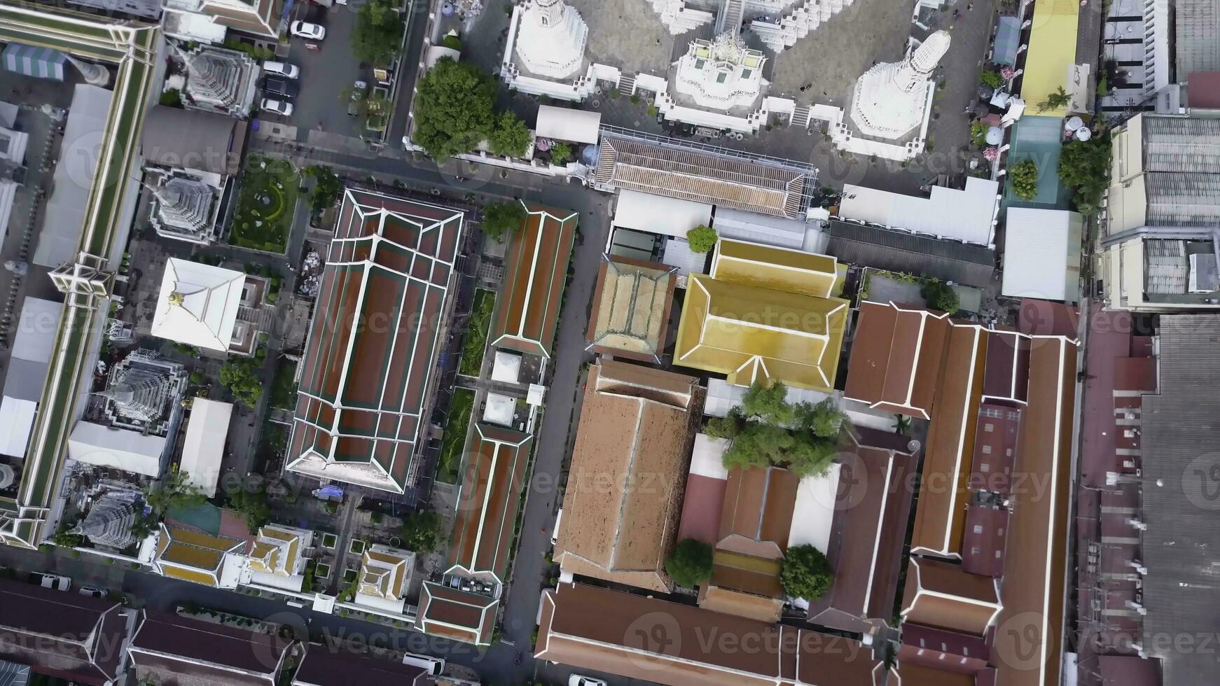 Nice view from the top of houses with tiled roofs. Top view of modern and old houses of the city. Cityscape of town and city from top view. Old and modern architecture of different styles. Authentic photo