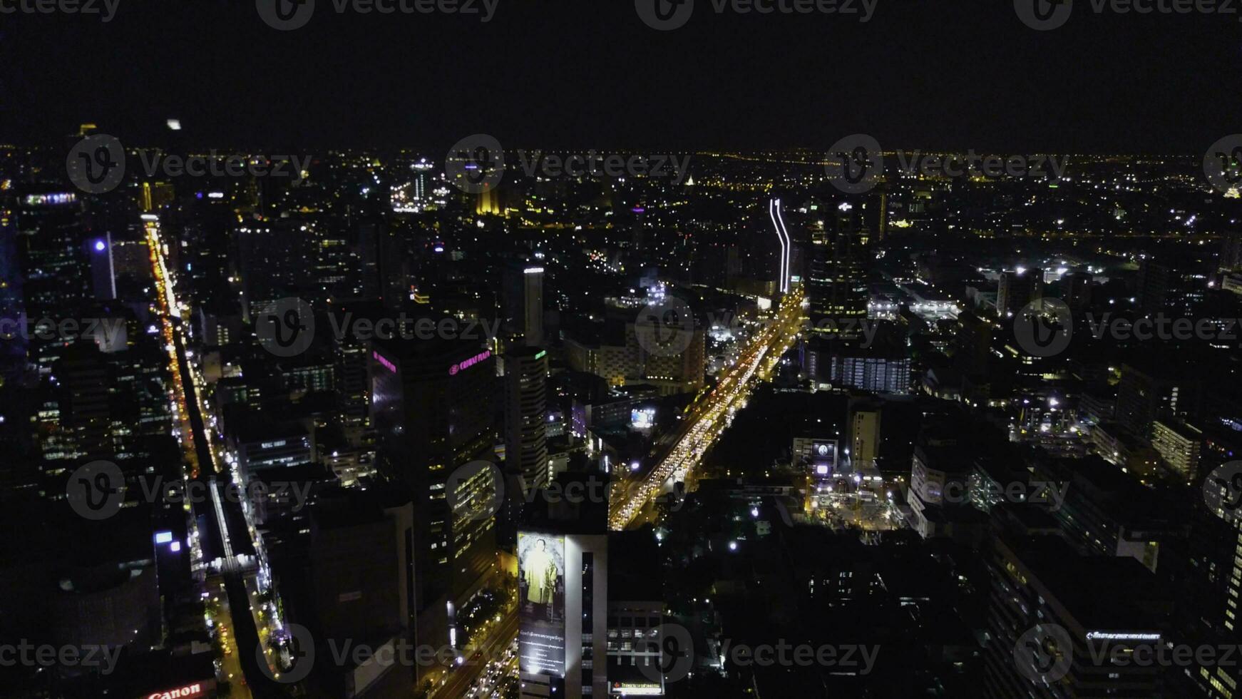 Aerial view of traffic at toll on expressway. Bangkok Expressway and Highway top view at dusk, Thailand. Aerial view of Bangkok buildings, Bangkok city downtown with sunset sky photo