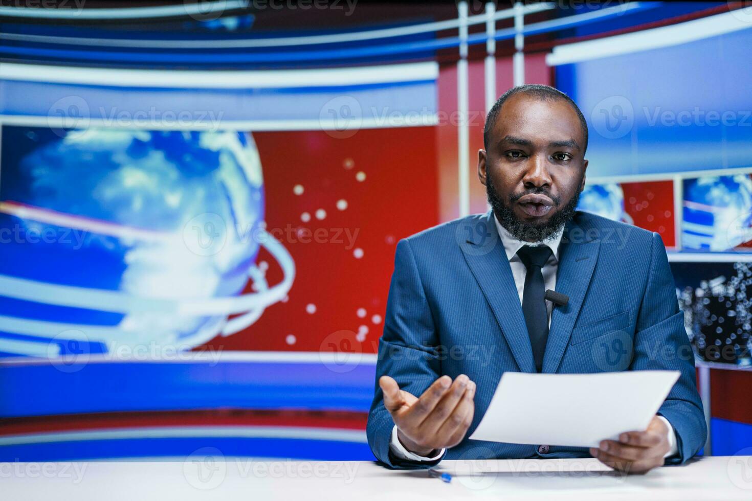 News reporter delivering breaking news on media segment in newsroom, reading important headlines of the day on international tv program. Man journalist presenting daily events live. photo
