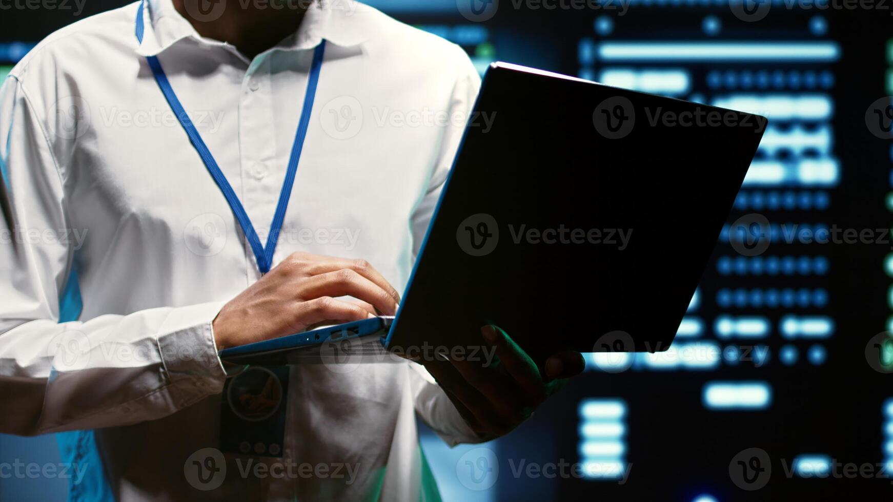Expert making sure servers in data storage enterprise are perfectly equipped to provide redundancy, automatic failover and rapid reconfiguration of clusters to minimize failure of mainframes, close up photo