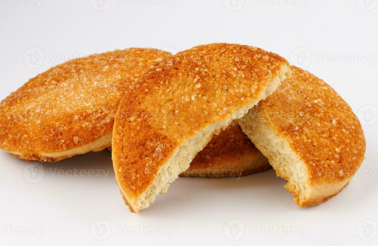 Beautiful round cookies on a white background. Whole and broken cookies. photo