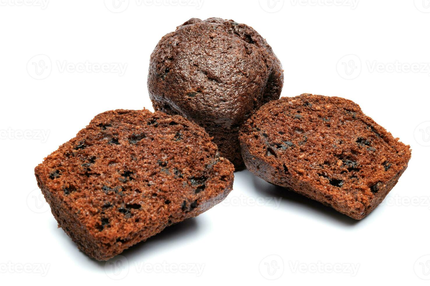Whole and cut in half chocolate muffin isolated on white background. Chocolate chip muffin. photo