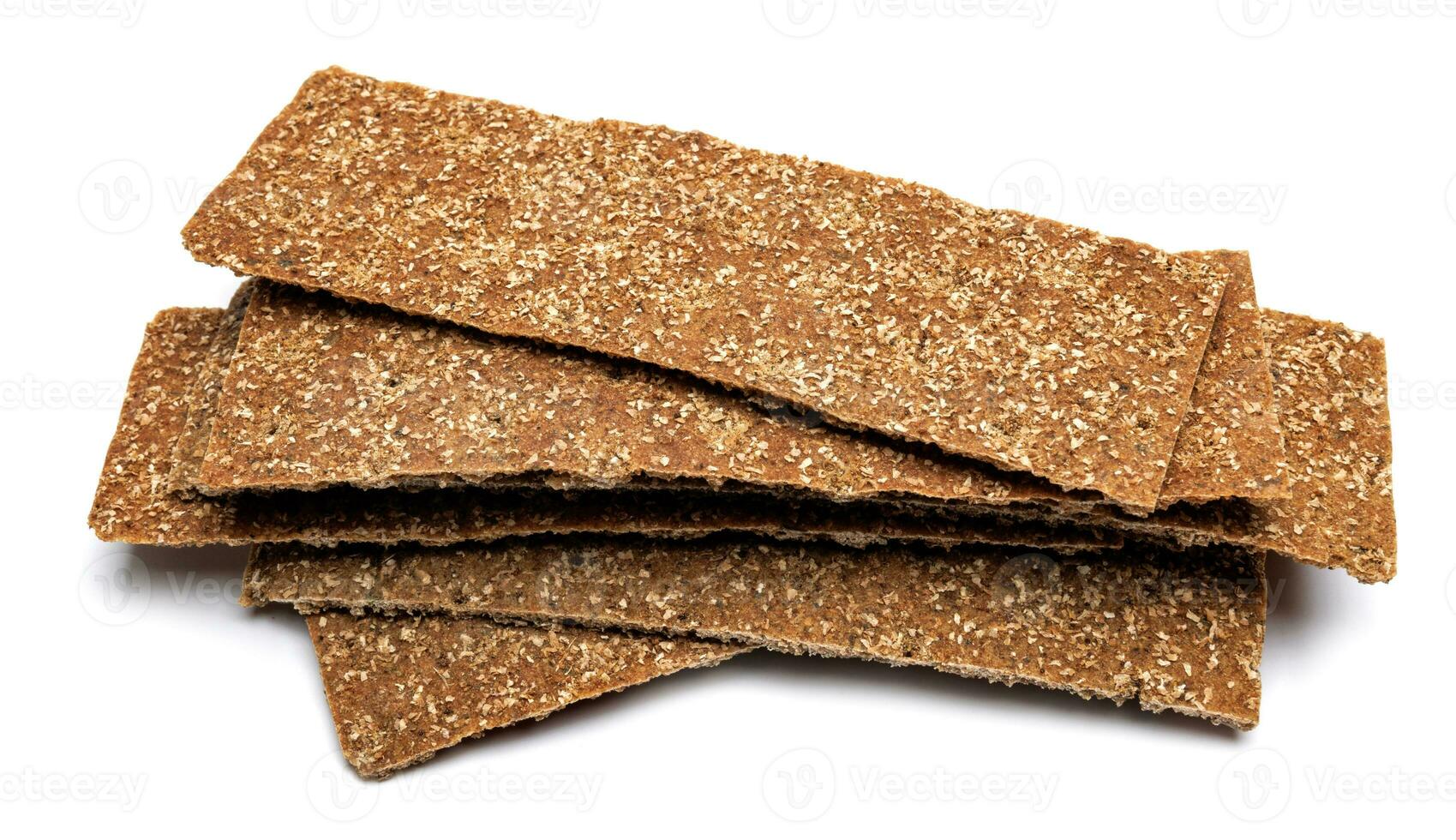 Slices of healthy low calories grain crisp bread for snack and crumbs on white background. photo