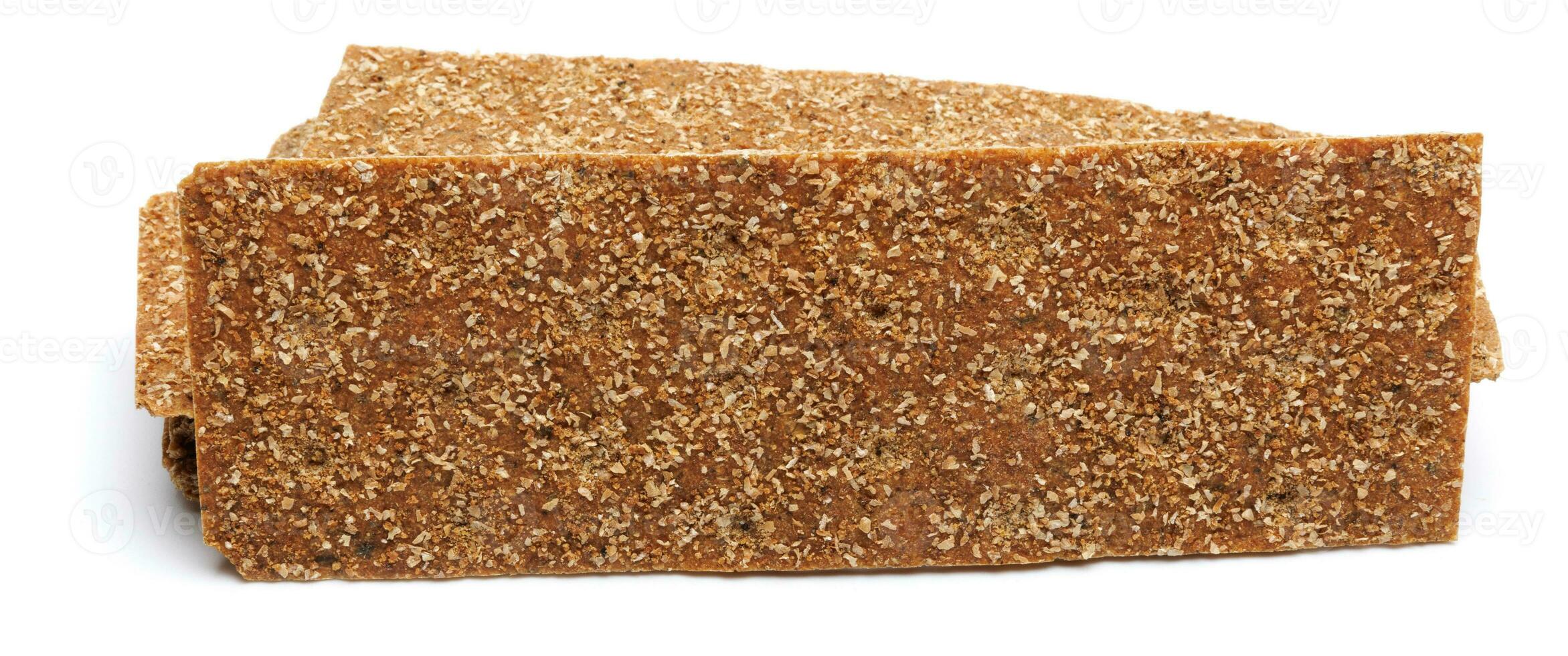 Slices of healthy low calories grain crisp bread for snack and crumbs on white background. photo