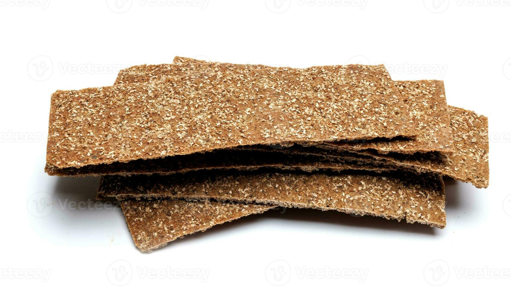 Slices of healthy low calories grain crisp bread for snack and crumbs on white background. photo