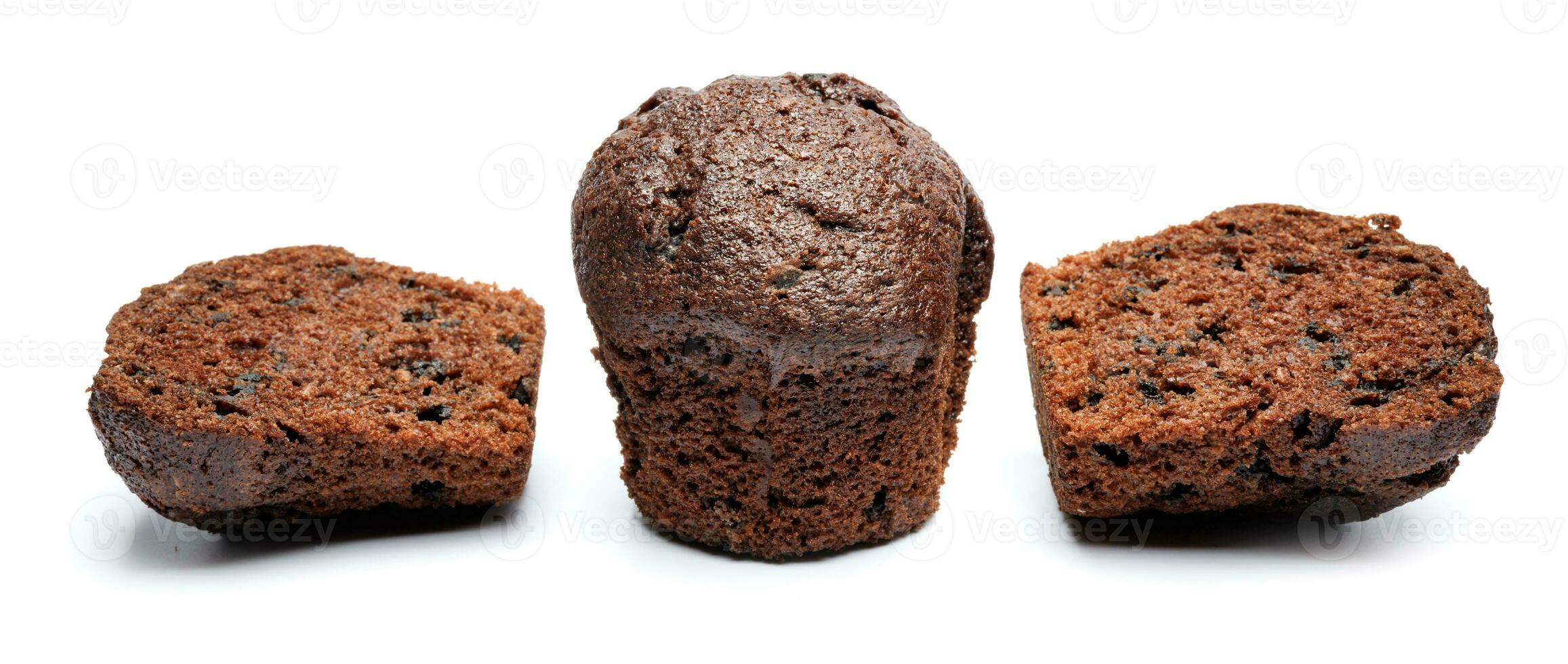 Whole and cut in half chocolate muffin isolated on white background. Chocolate chip muffin. photo