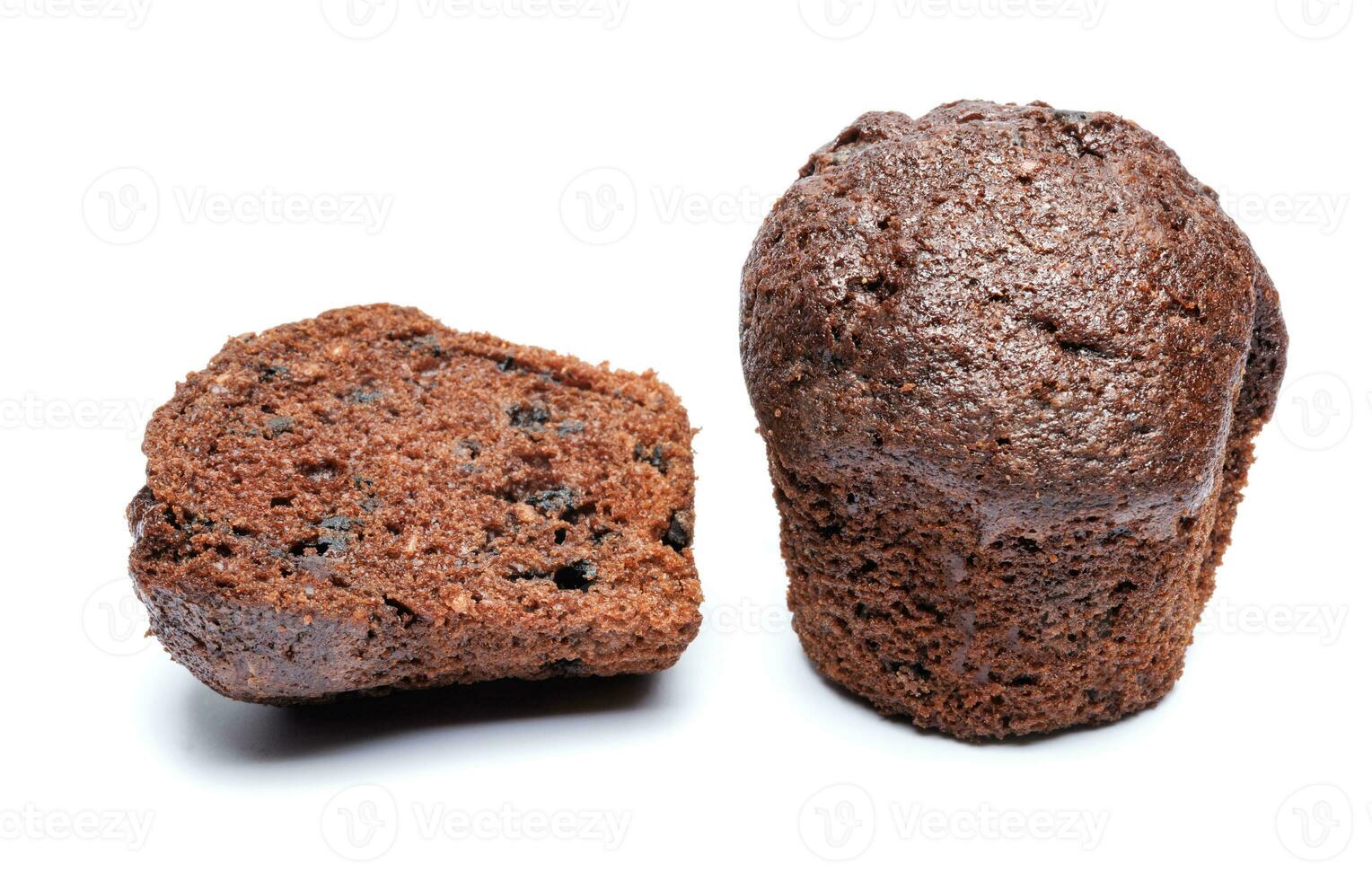 Whole and cut in half chocolate muffin isolated on white background. Chocolate chip muffin. photo