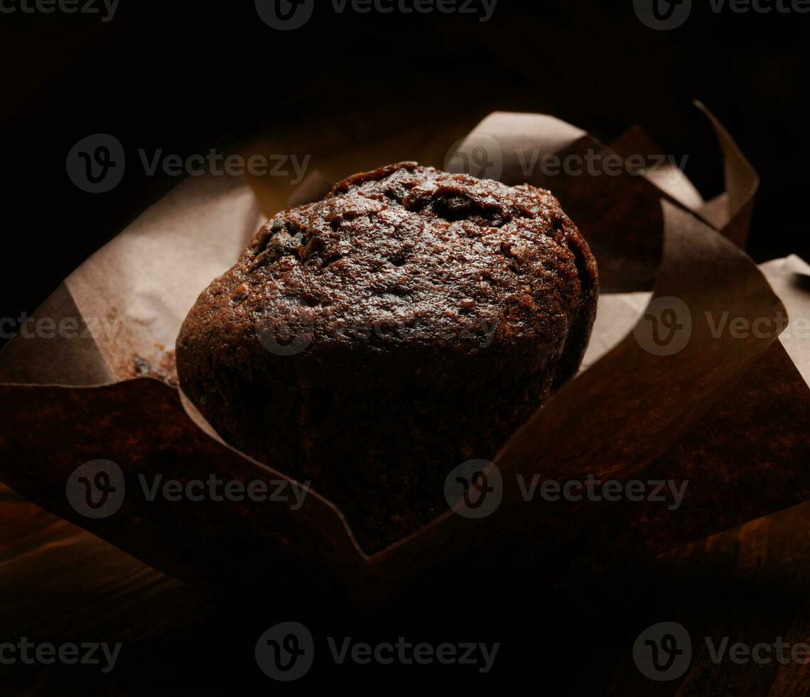 Chocolate muffin close-up .Muffin with chocolate chips. photo