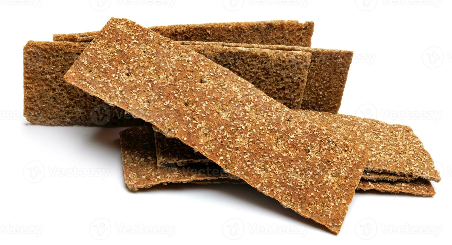 Slices of healthy low calories grain crisp bread for snack and crumbs on white background. photo