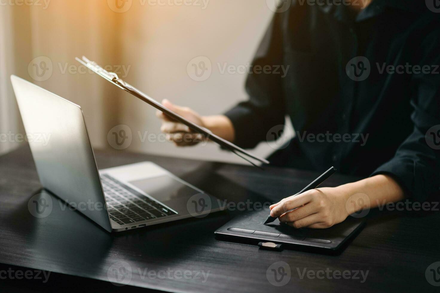 business documents on office desk with laptop and smart phone and graph business diagram and man working in office photo