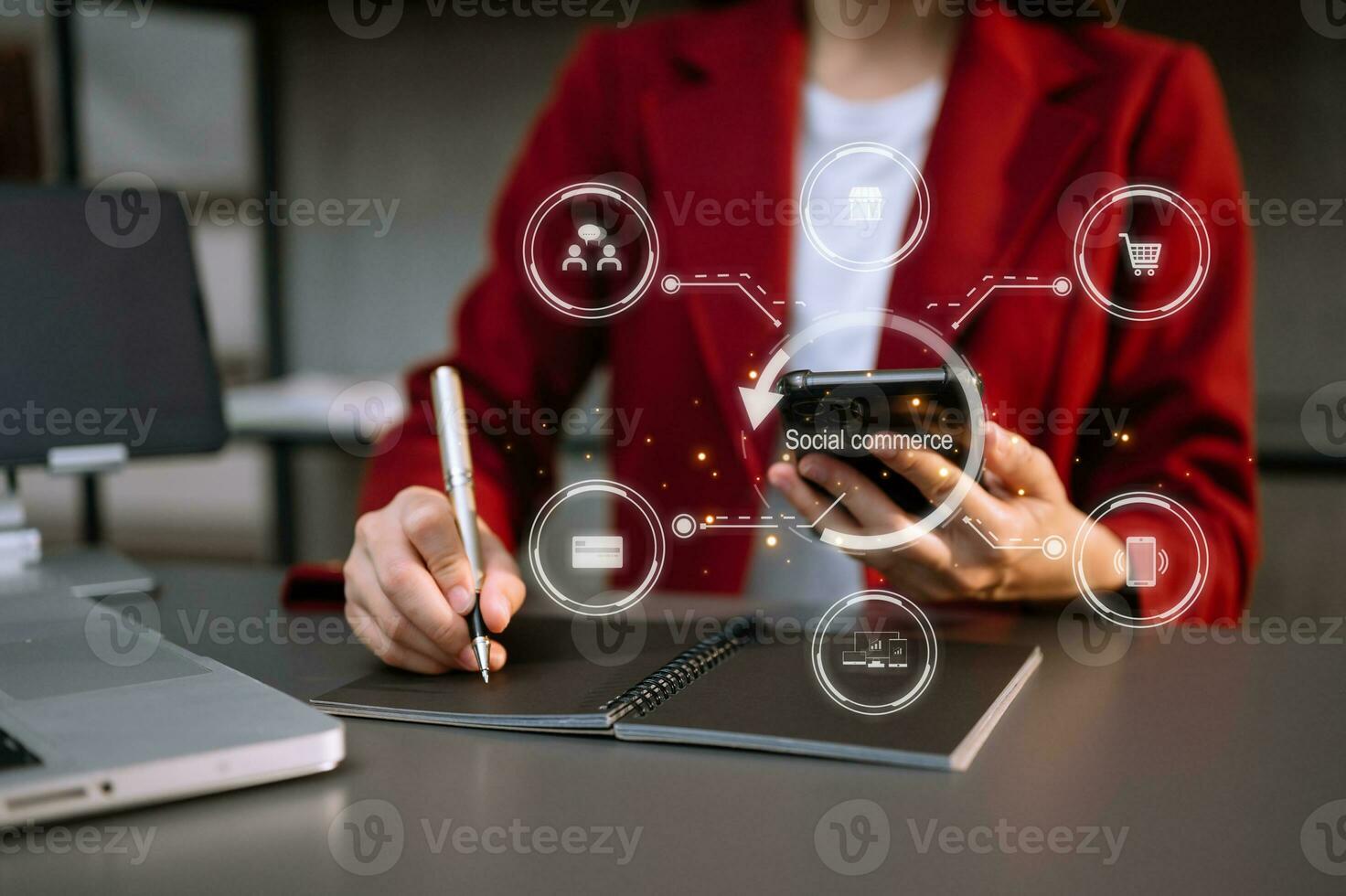 Hand using smart phone and tablet with social commerce icon on virtual screen e-commerce and social media marketing, community in office Social commerce concept photo