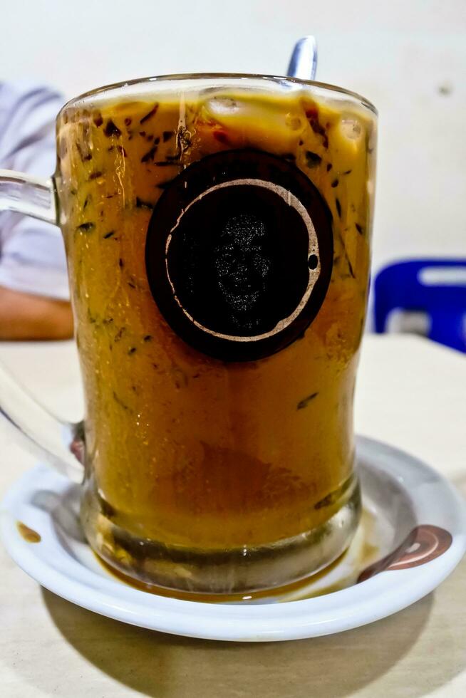 close-up view of a glass of iced cappuccino coffee photo