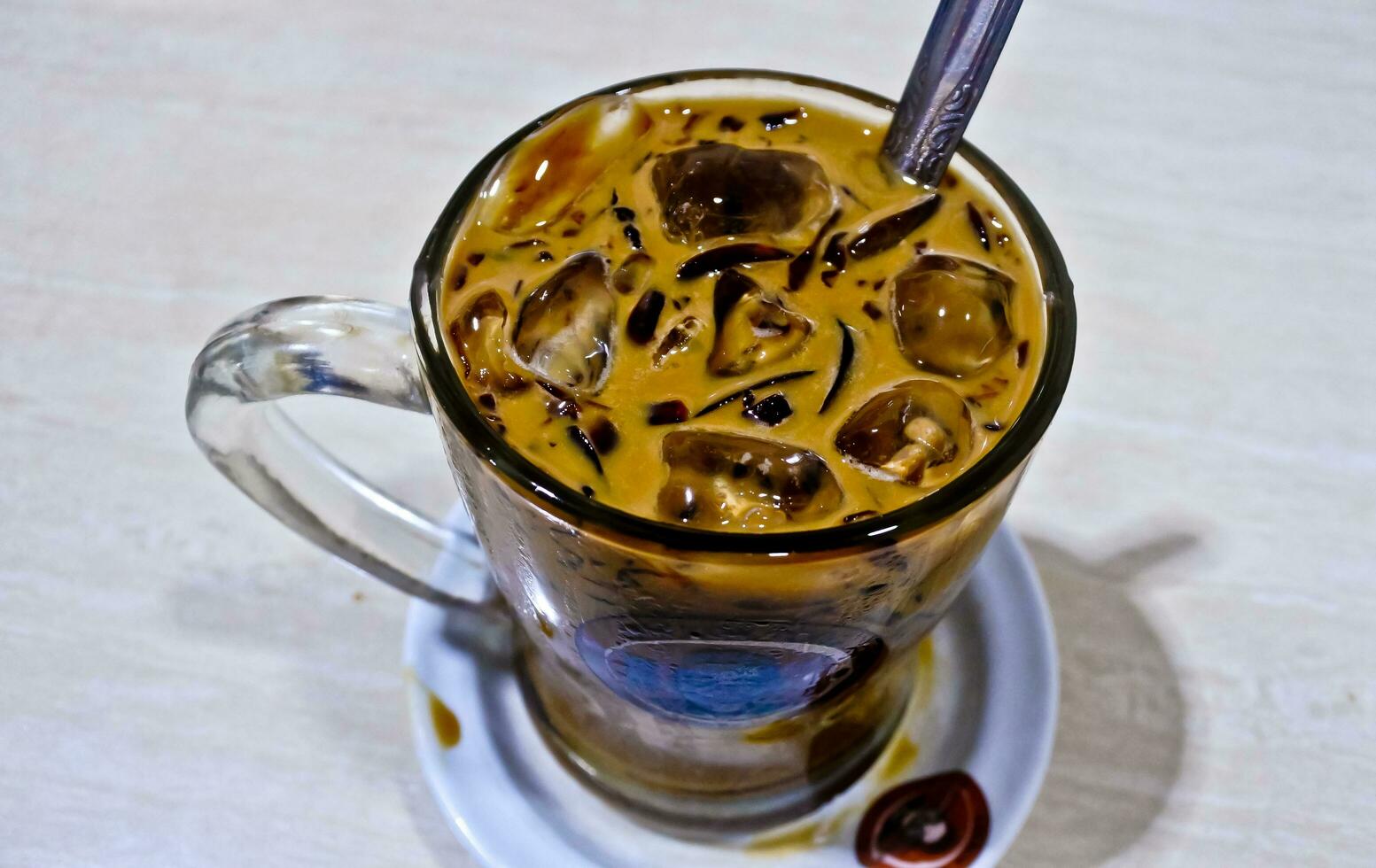 close-up view of a glass of iced cappuccino coffee photo