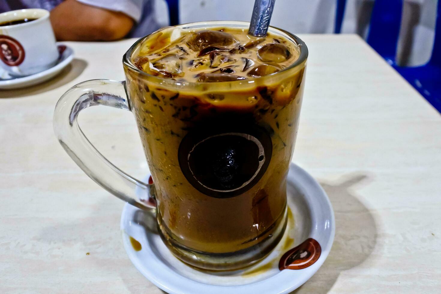 close-up view of a glass of iced cappuccino coffee photo