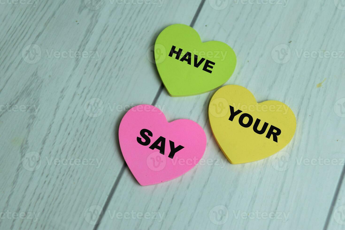 Concept of Have Your Say write on sticky notes isolated on Wooden Table. photo