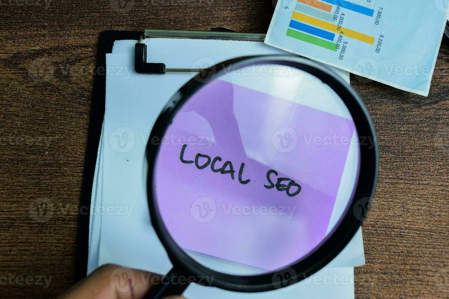 Concept of Local SEO write on sticky notes isolated on Wooden Table. photo