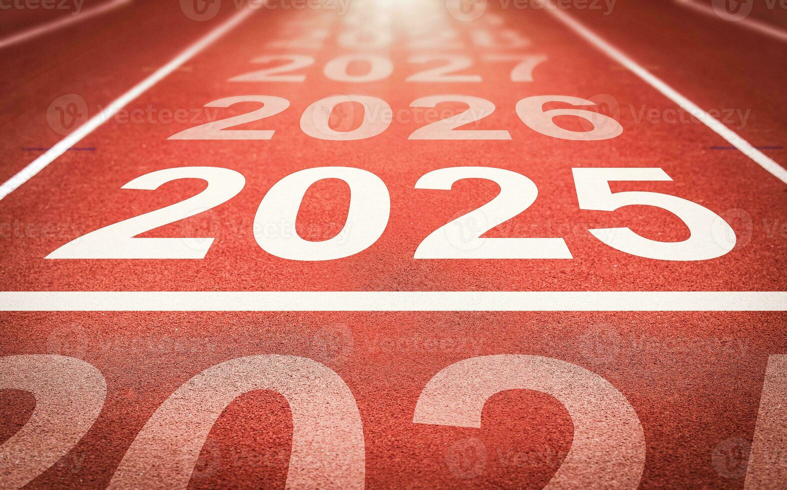 Start of new year. Changes of year 2025, 2026, 2027 on Running track. Concept of new ideas starting in new year, planning along with setting objectives to set KPI goals for success in life. photo