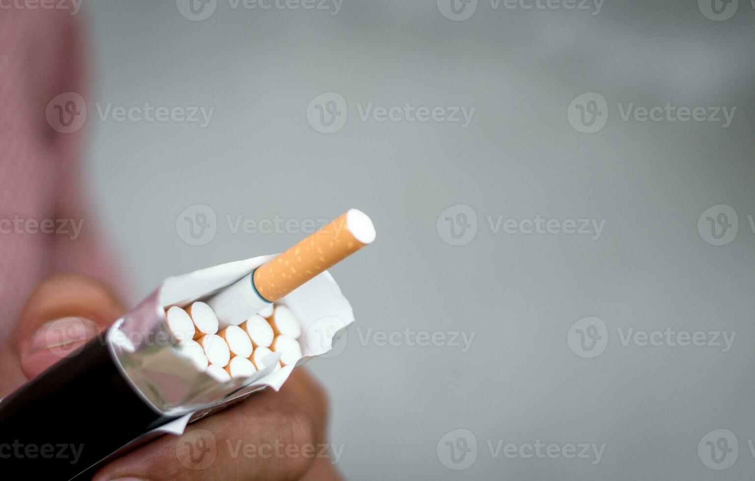 Smoker person open and giving cigarette to another photo