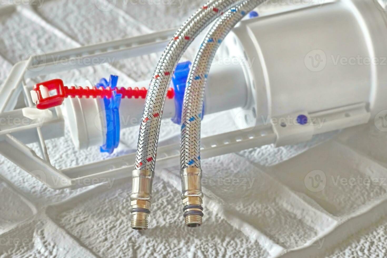 Plumbing. Flexible metal steel faucet hoses, flush mechanism, siphon fittings photo