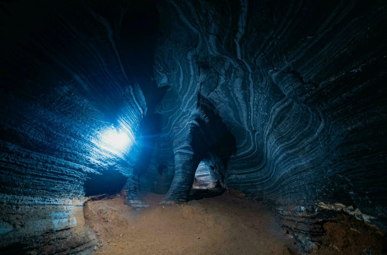 Unseen in Thailand, the blue cave features a natural blue marble color pattern on its walls. photo