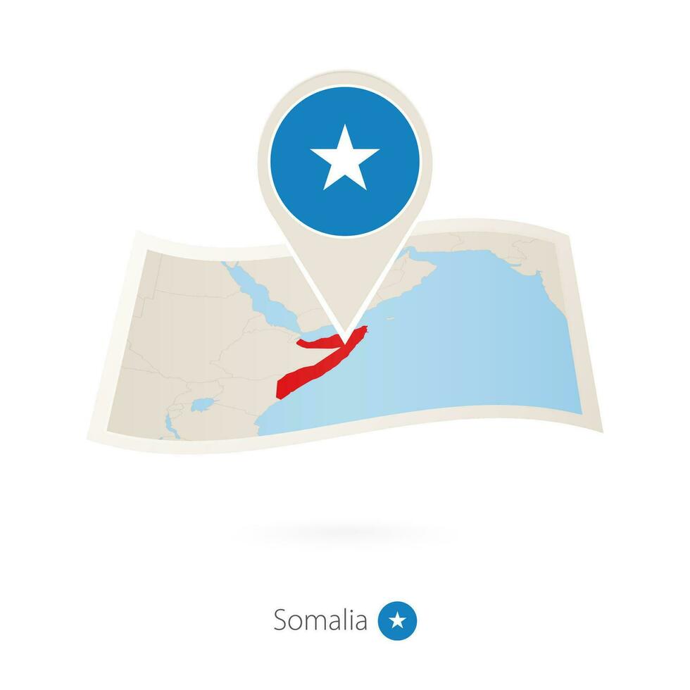 Folded paper map of Somalia with flag pin of Somalia. vector