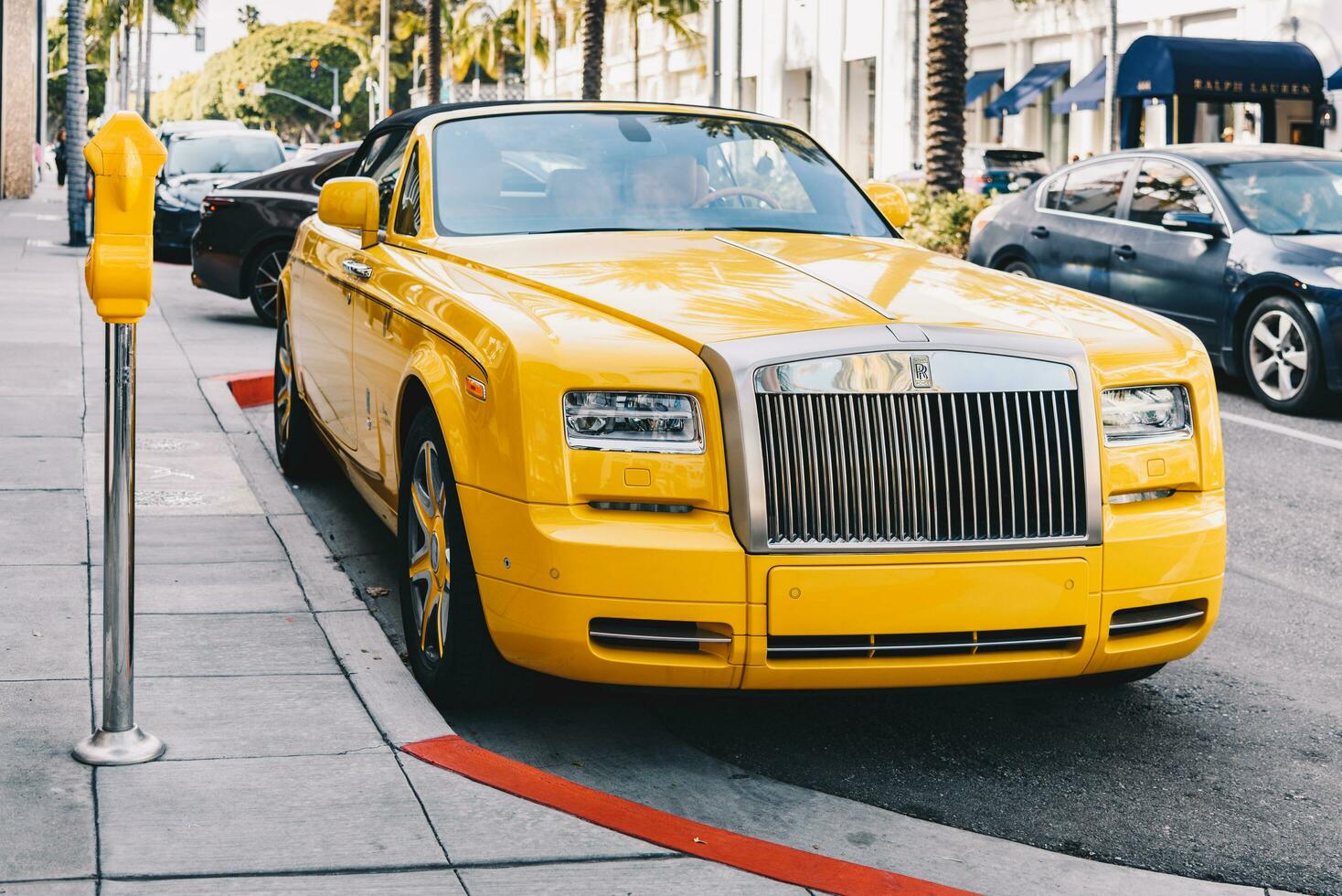 Los Angeles, CA - Apr 19, 2023 - Rolls Royce Phantom Drophead Coupe owned by Bijan Pakzad parked parked on the Rodeo Drive photo