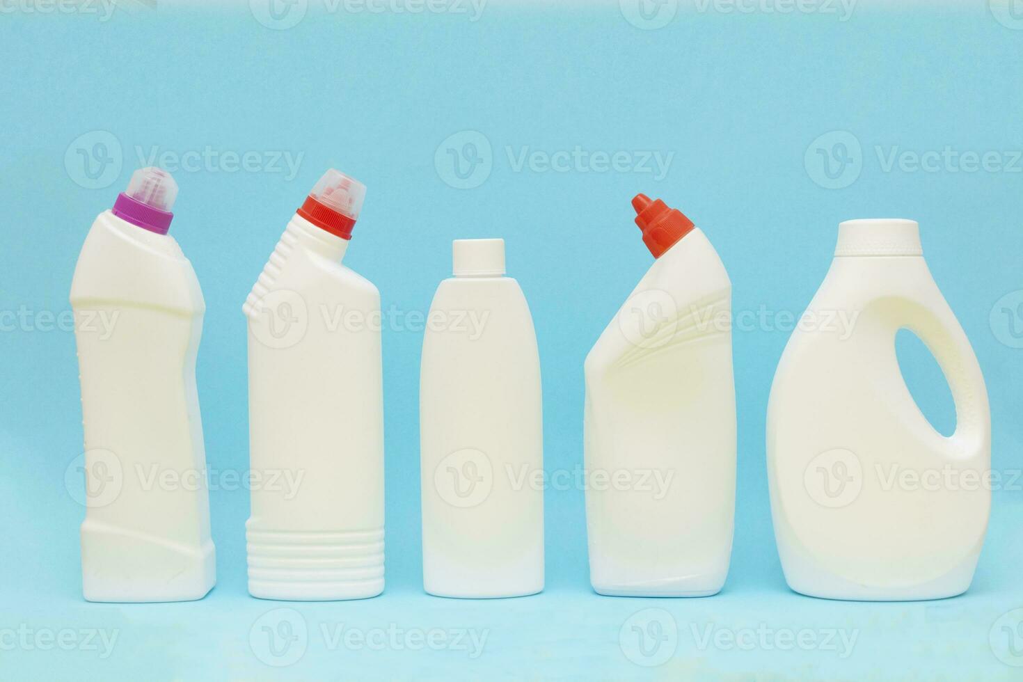 white plastic container on blue background. Powder bottle mockup photo