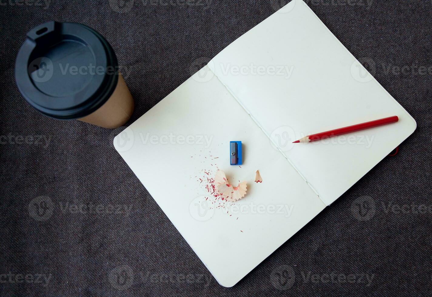 Pencil, notebook and paper coffee cup photo