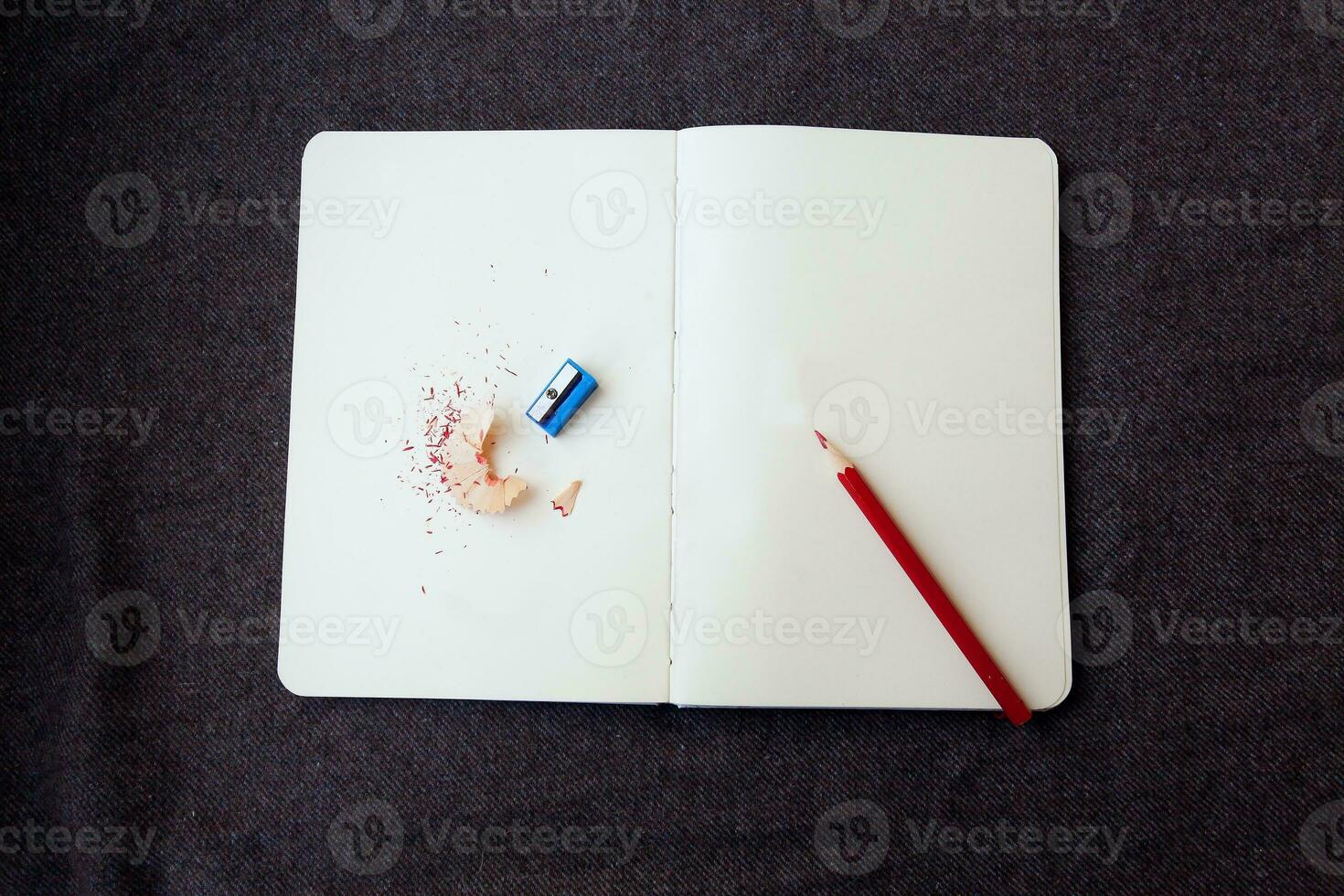 notebook with pencil and shavings photo