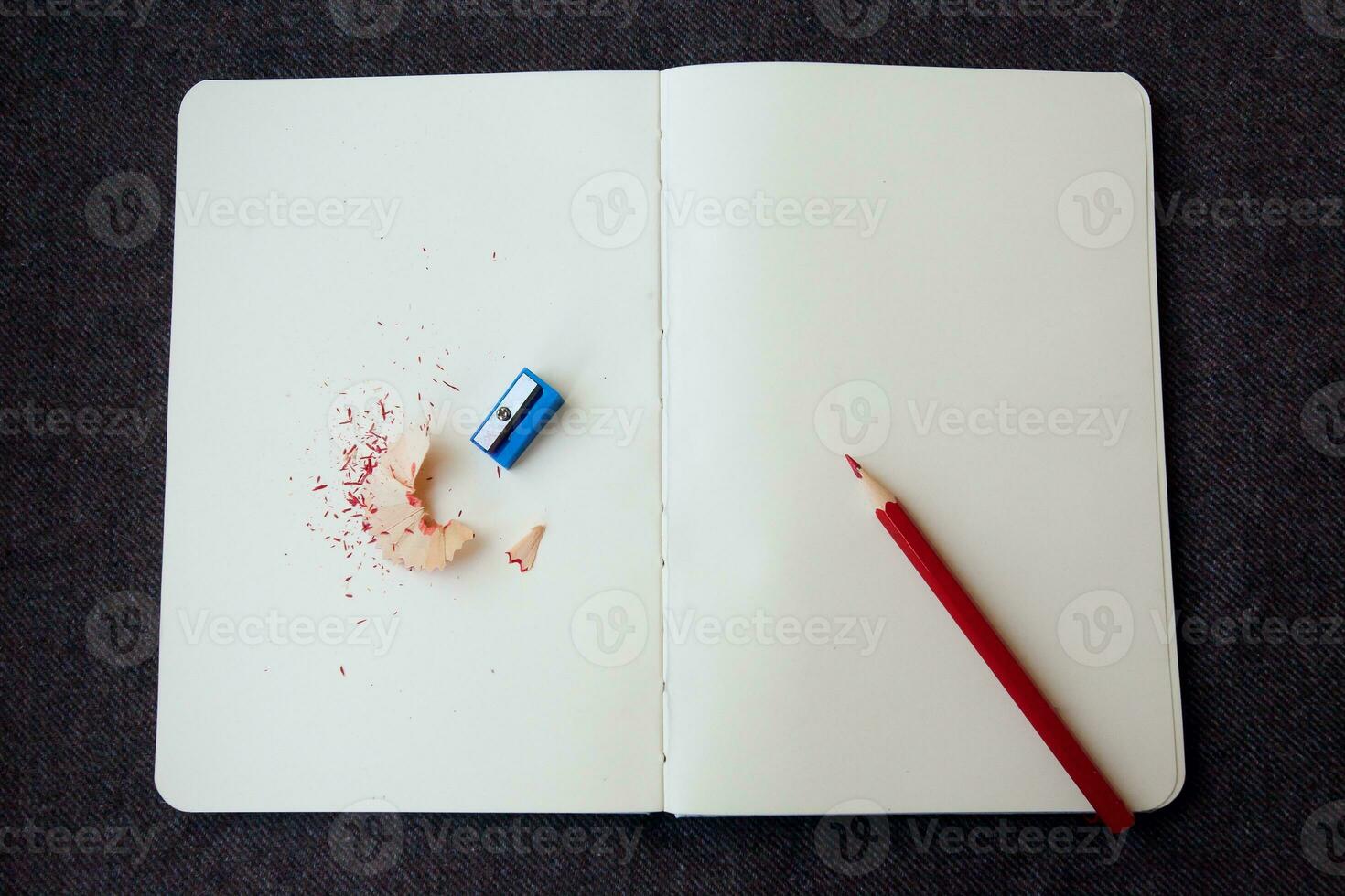 notebook with pencil and shavings photo