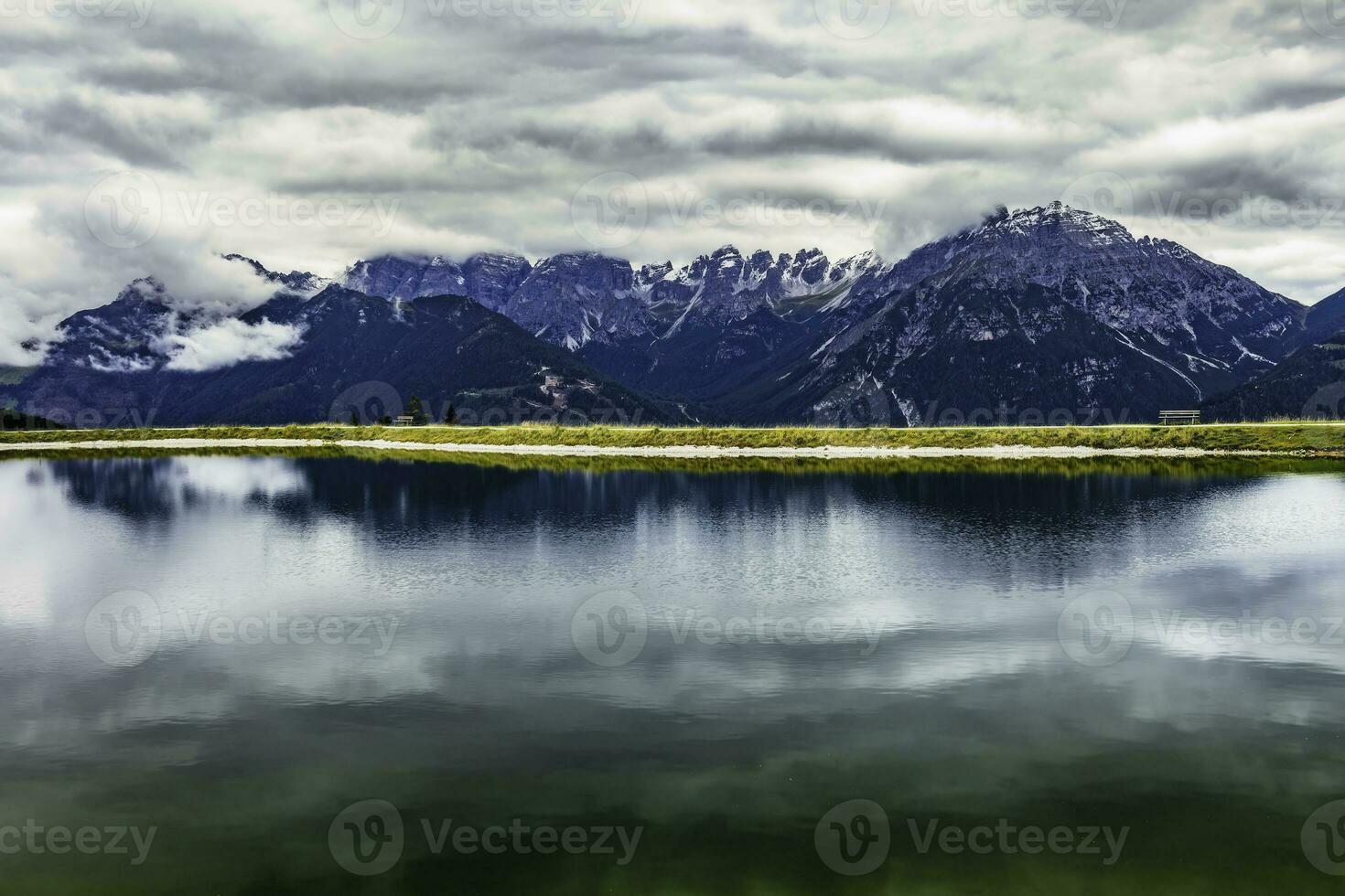 Alpine peaks with reflection photo
