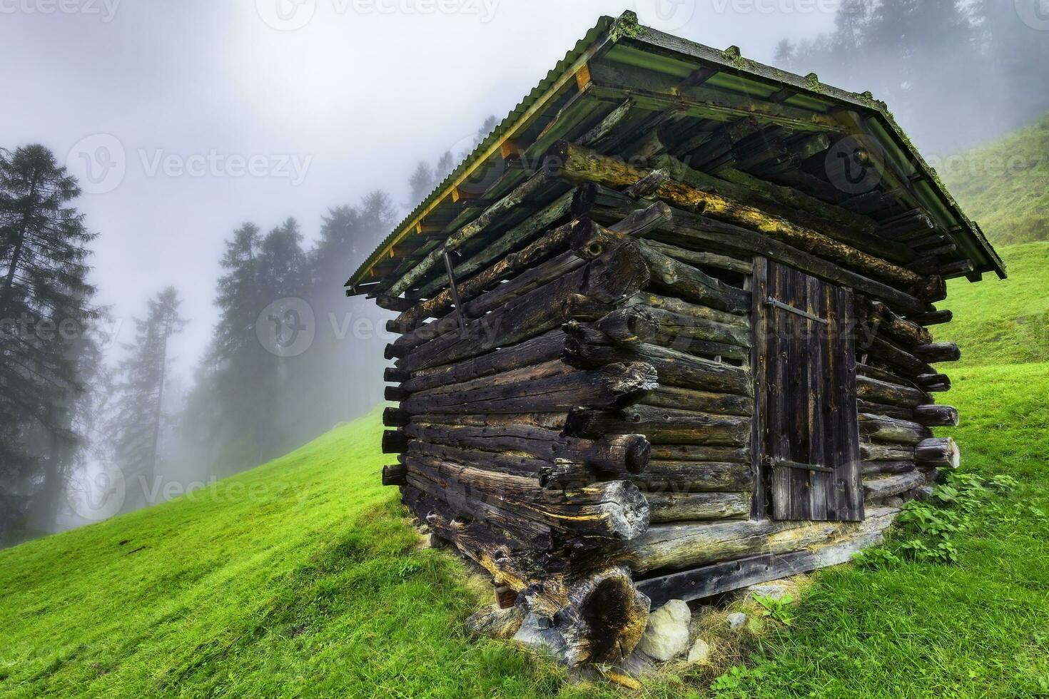 Wooden hayloft in the Stubai Alps photo