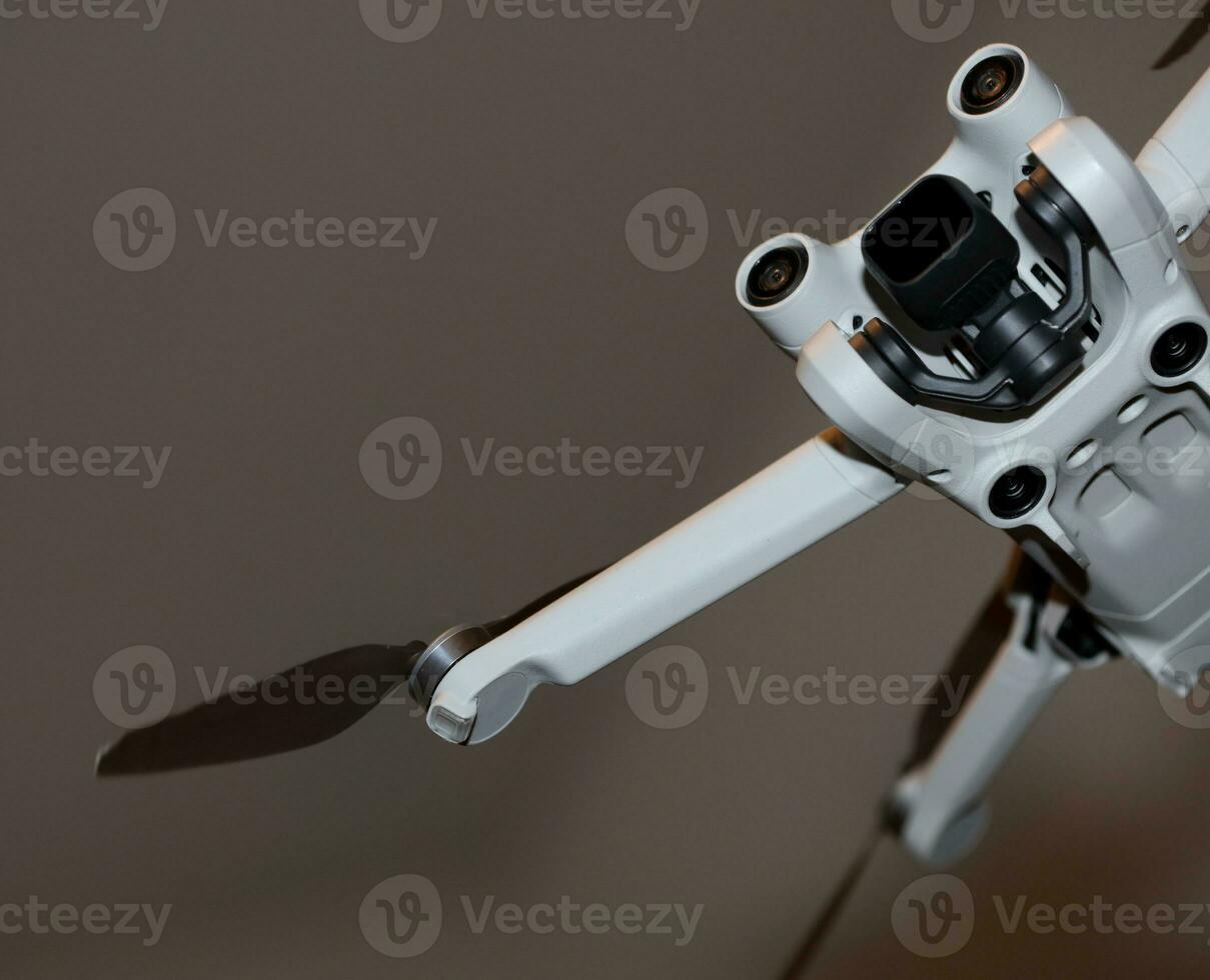 Macro view drone sensor and drone propeller focus is on second propeller droning concept video film making operator rent equipment backgrounds high quality footages photo
