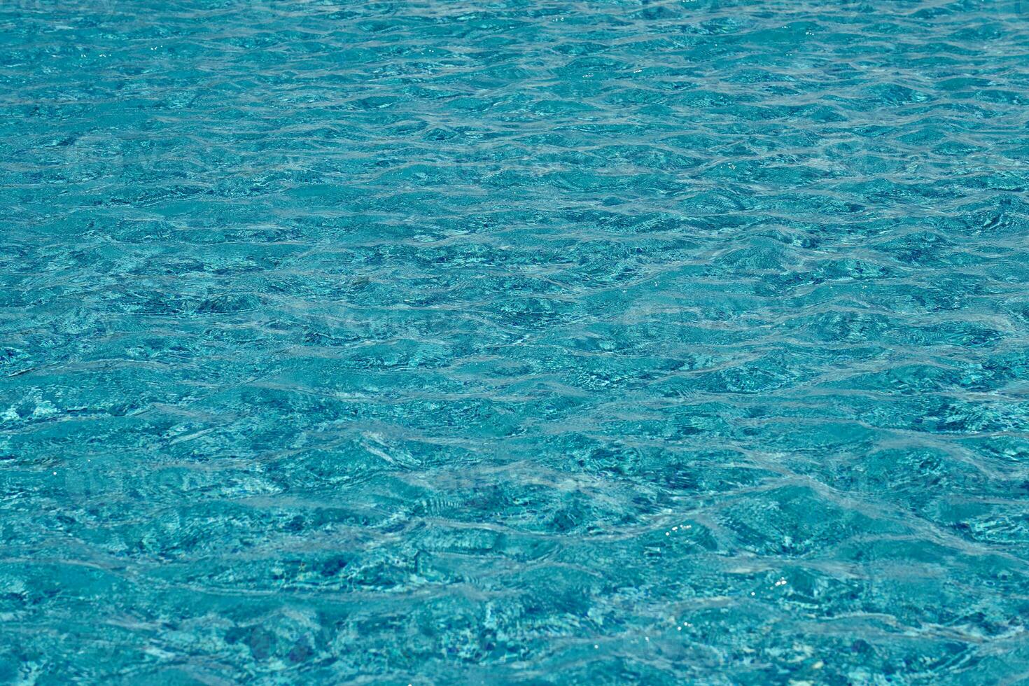 The texture of the water surface in the pool as a background. photo