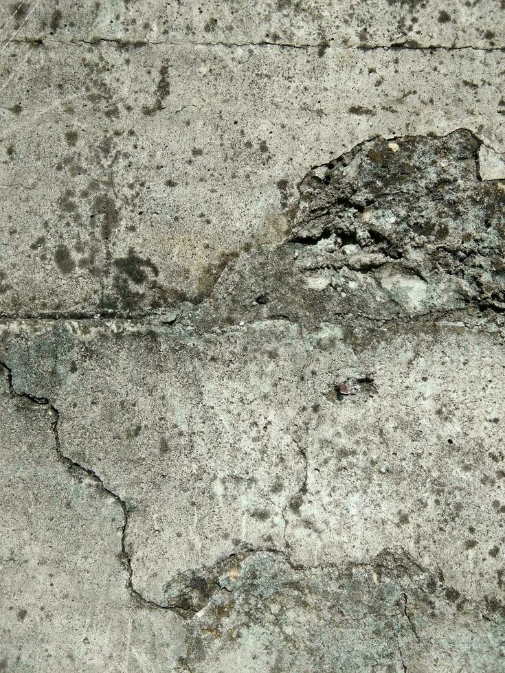 Crack concrete wall. Old dirty cracked wall texture photo