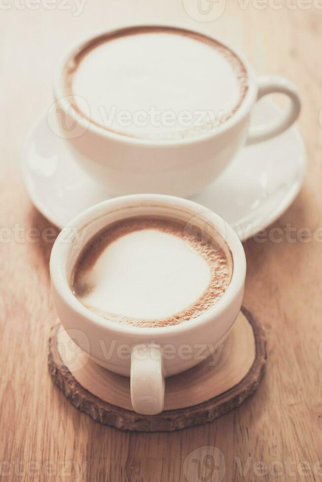 capucino coffee on wood table photo