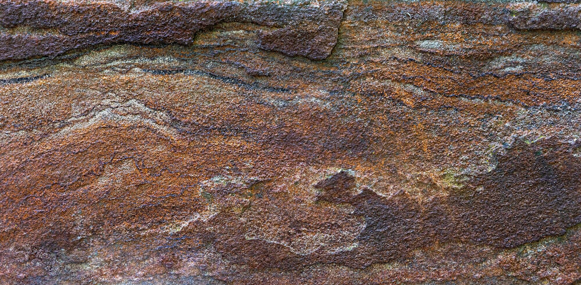 Texture of a stone fence. Natural background. Close-up. Selective focus. photo