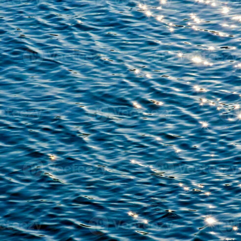 ocean water background abstract background of seawater flow under light exposure photo