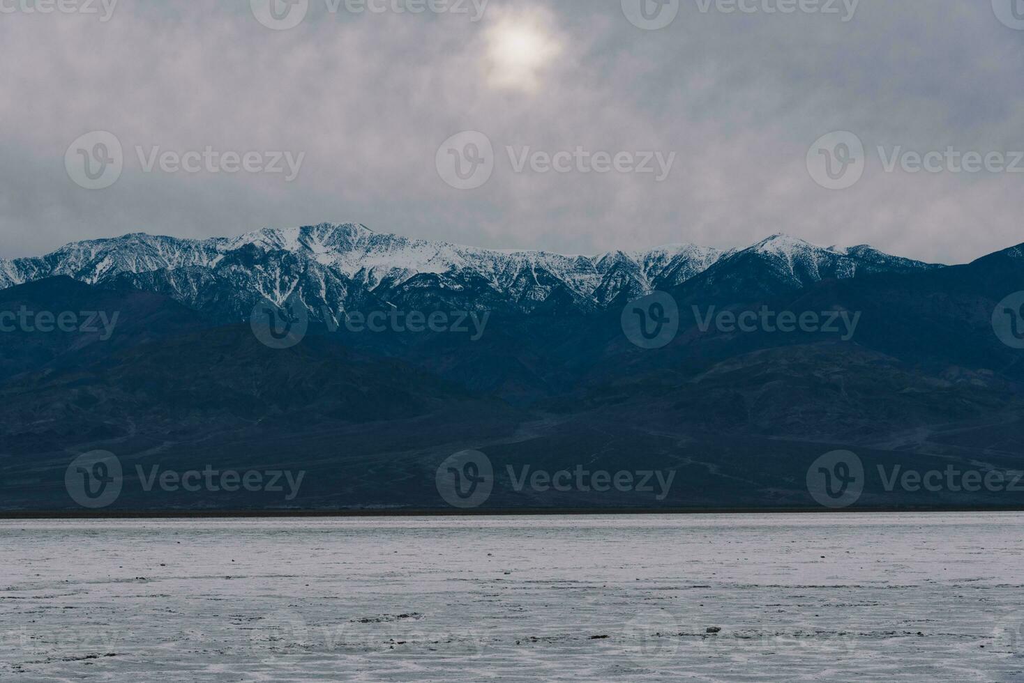 Death Valley salt lake during sunset photo