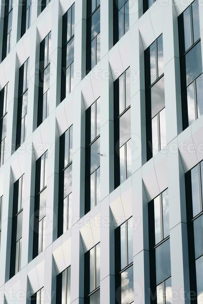 Sky reflecting on white office facade photo