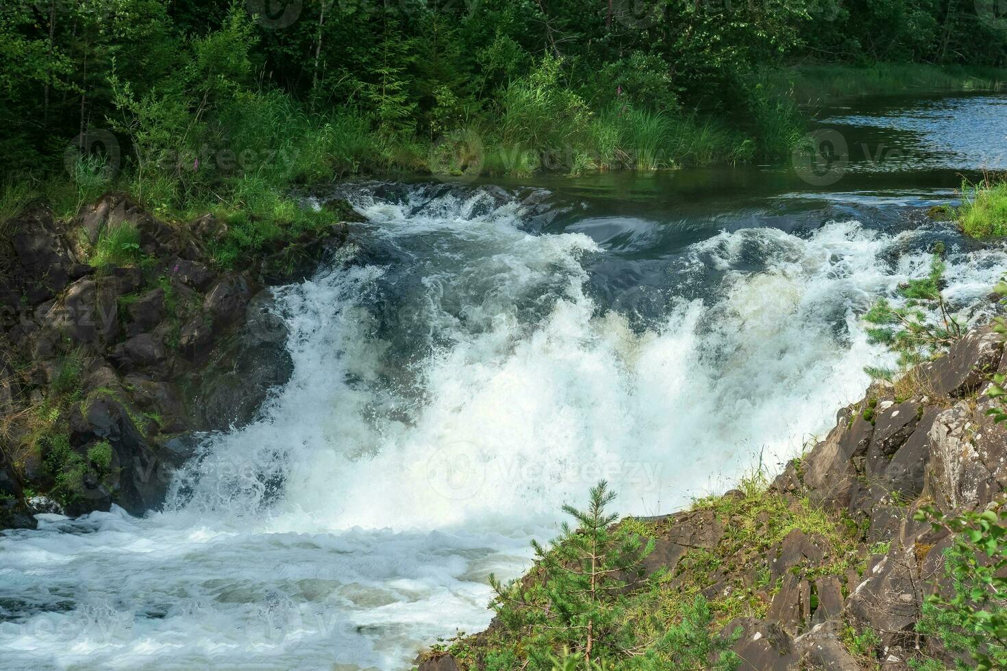 natural landscape with a small waterfall with clear water photo